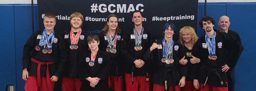 Competitors posing in gi's